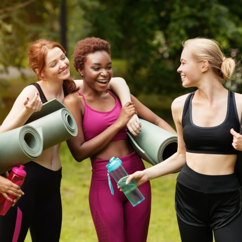 Group of women celebrating with yoga mats at a hen party in Lisbon Group of women celebrating with yoga mats at a hen party in Lisbon